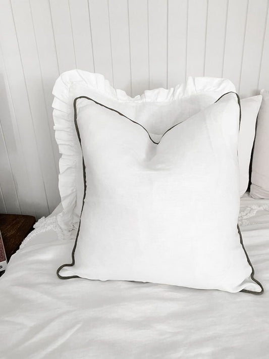 White linen cushion with Olive Green piping, piped linen cushion covers, Olive Green piping, Pure white linen cushion covers, coastal cushion covers, bedroom cushions, living room cushions, Hamptons cushions, beach houuse cushion covers, linen beach house cushions, white piped cushions with wooden buttons, cushion designs, cushion styles, linen cushion styles, cushion trends